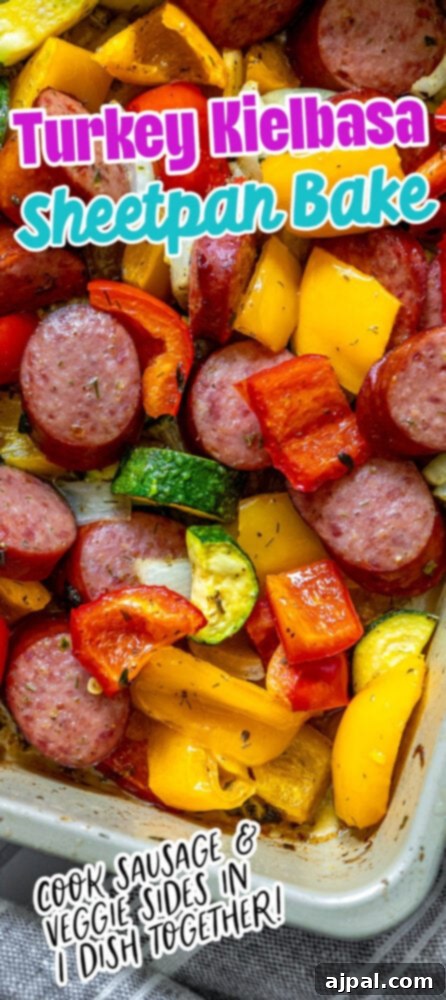 Easy Kielbasa Sheet Pan Dinner 11 picture of turkey kielbasa, bell peppers, onions, and herb dressing baked on a baking sheet on a table