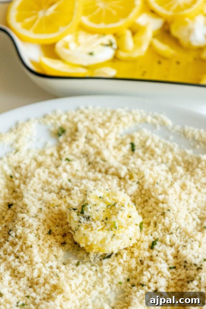 Warm Goat Cheese Bites 9 goat cheese being rolled in breadcrumbs