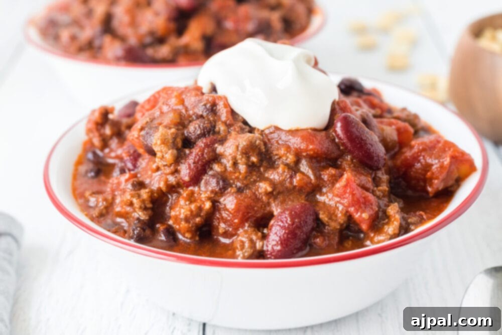 picture of chili in a bowl with sour cream on top
