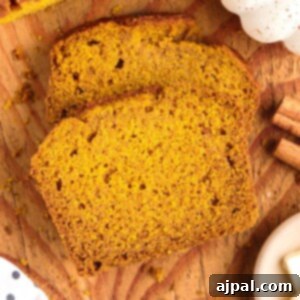 Moist Spiced Pumpkin Loaf 18 picture of sliced pumpkin bread on a cutting board