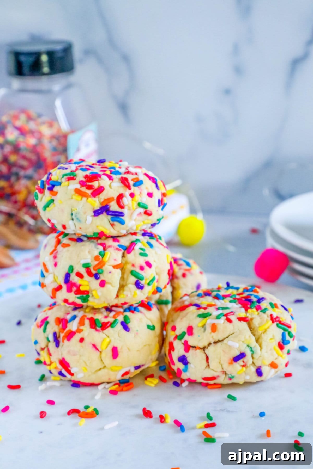 Mega Sprinkle Celebration Cookies 13 A stack of Jumbo Funfetti Cookies on a marble table.