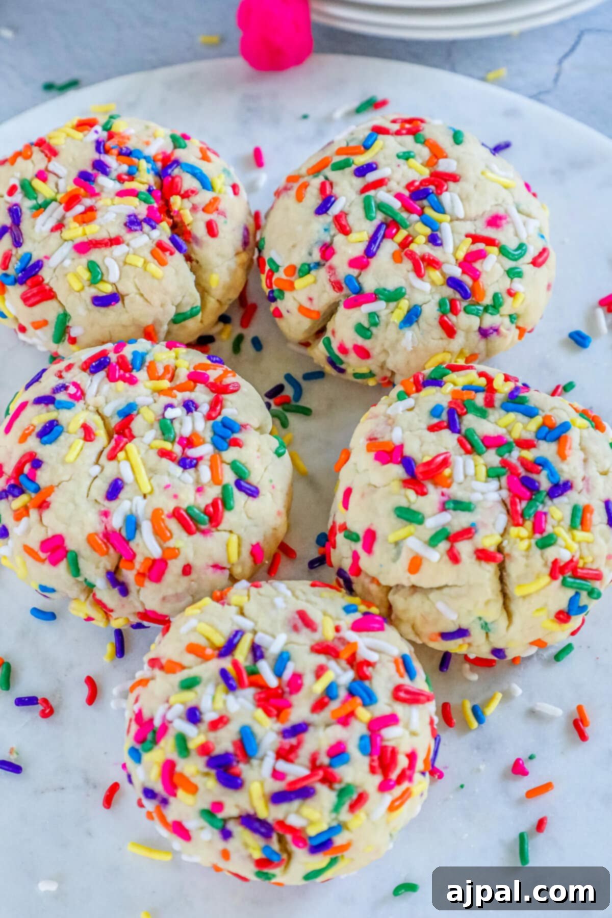 Mega Sprinkle Celebration Cookies 3 Jumbo Funfetti Cookies on a white plate.