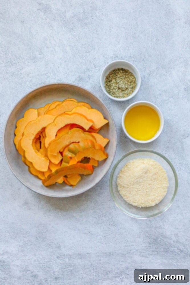 A bowl with fresh ingredients for herb roasted acorn squash, including herbs, spices, and grated Parmesan cheese.