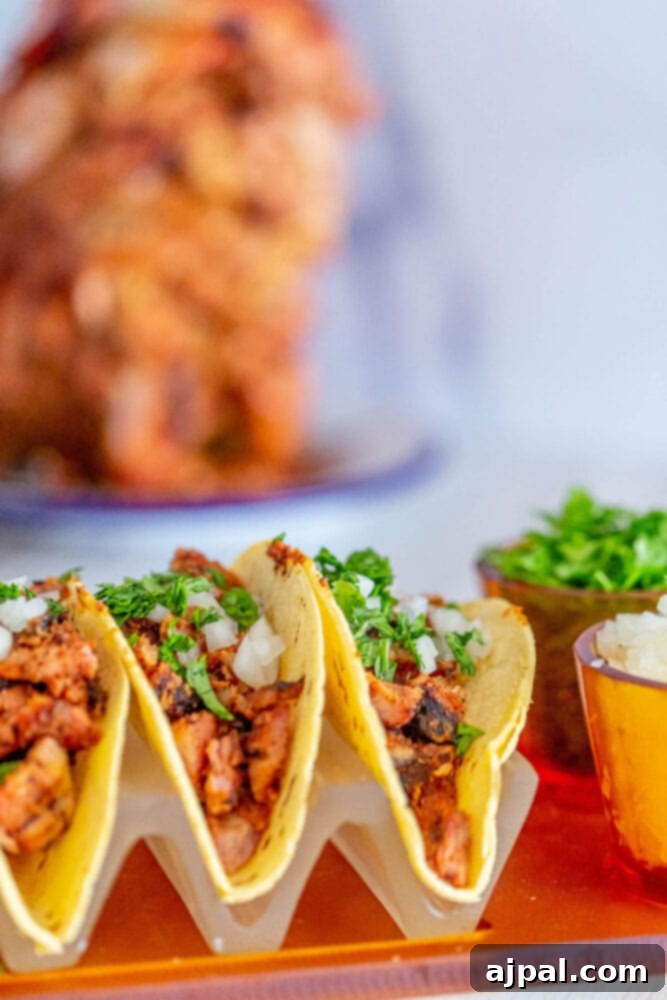 Easy smoked al pastor chicken tacos served on an orange tray.
