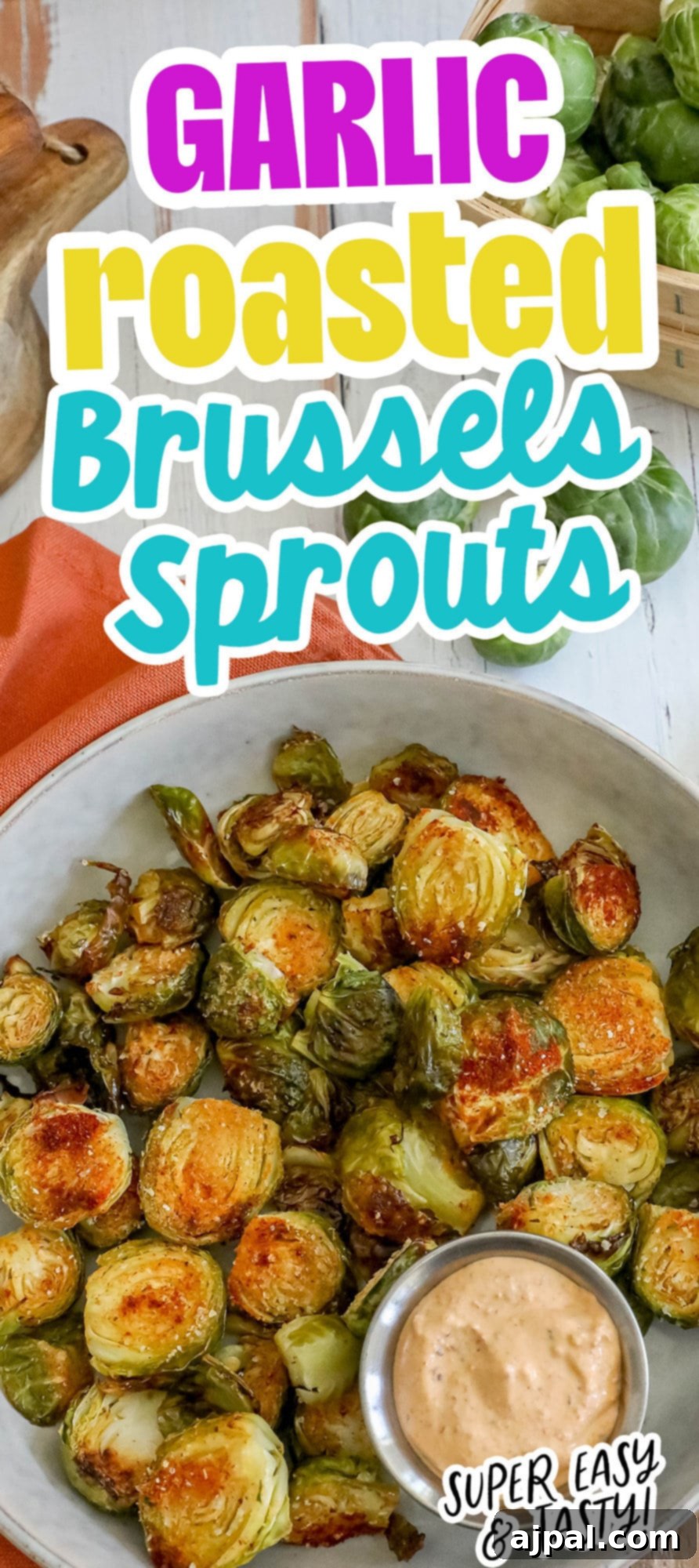 Crispy Garlic Roasted Brussels 12 A bowl of garlic roasted Brussels sprouts beautifully presented with a rich dipping sauce on the side.