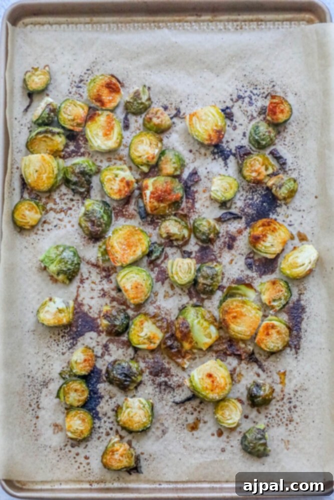 Crispy Garlic Roasted Brussels 8 Perfectly roasted garlic Brussels sprouts with crispy edges and tender centers, golden-brown and ready to be served directly from the baking sheet.