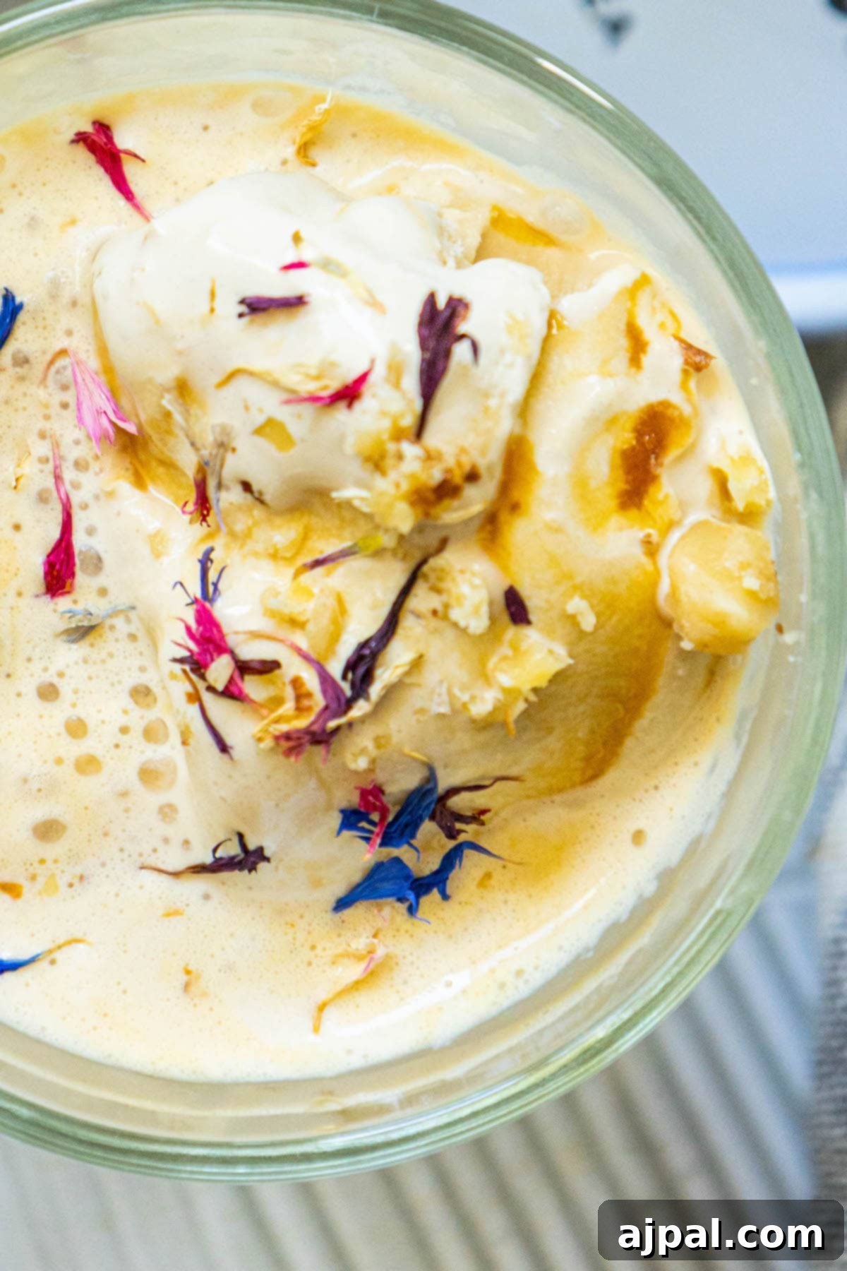 A beautifully presented Earl Grey Affogato with edible flowers, served in a bowl, capturing its creamy texture.