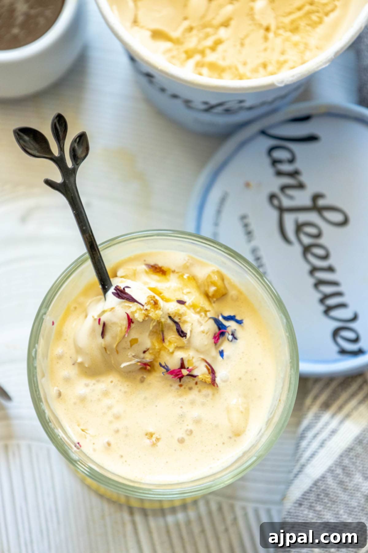 A bowl of Earl Grey Affogato with a spoon resting beside it, inviting you to enjoy this unique dessert.
