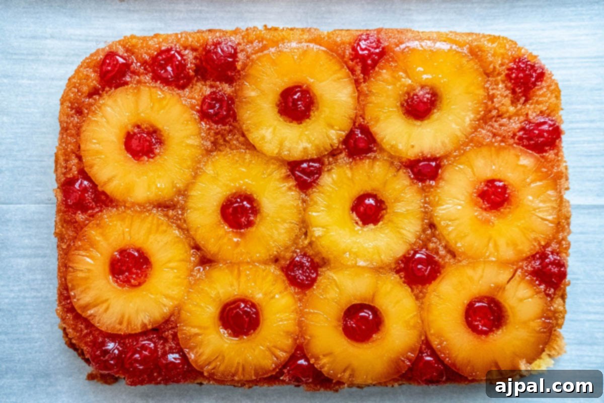 Caramelized Pineapple Bliss 13 picture of pineapple upside down cake with a pineapples and maraschino cherries baked onto the top