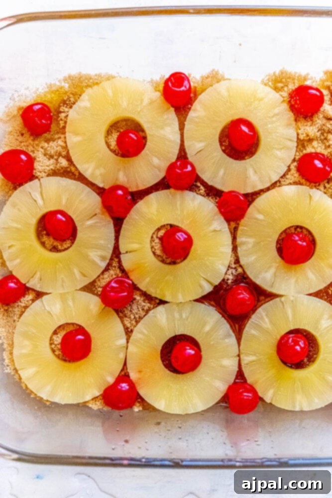 Caramelized Pineapple Bliss 7 picture of pineapple and cherries in a prepped cake pan