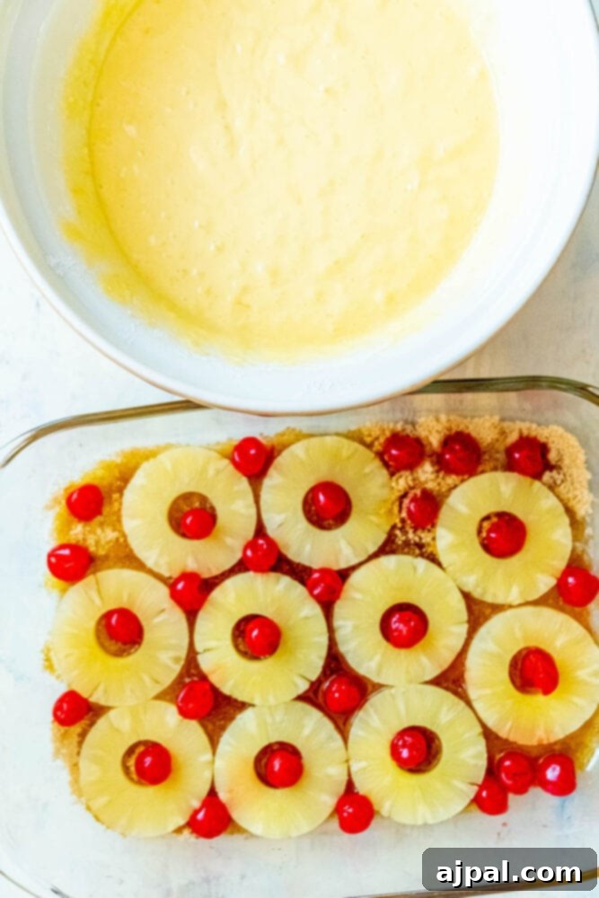 Caramelized Pineapple Bliss 8 picture of cake mix and prepped cake pan with pineapple rings and cherries on top