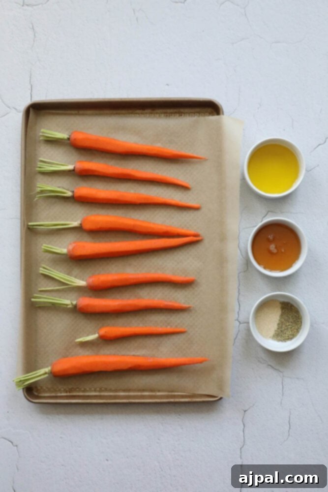 picture of prepped carrots, honey, garlic, herbs on a table