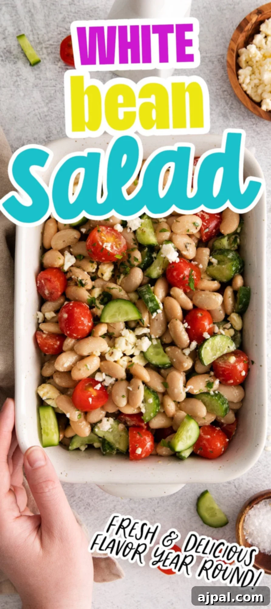 A vibrant white bean salad featuring feta, crisp cucumber, and fresh herbs, with a person holding a fork ready to enjoy this healthy and fresh Mediterranean dish, emphasizing its appetizing appeal.