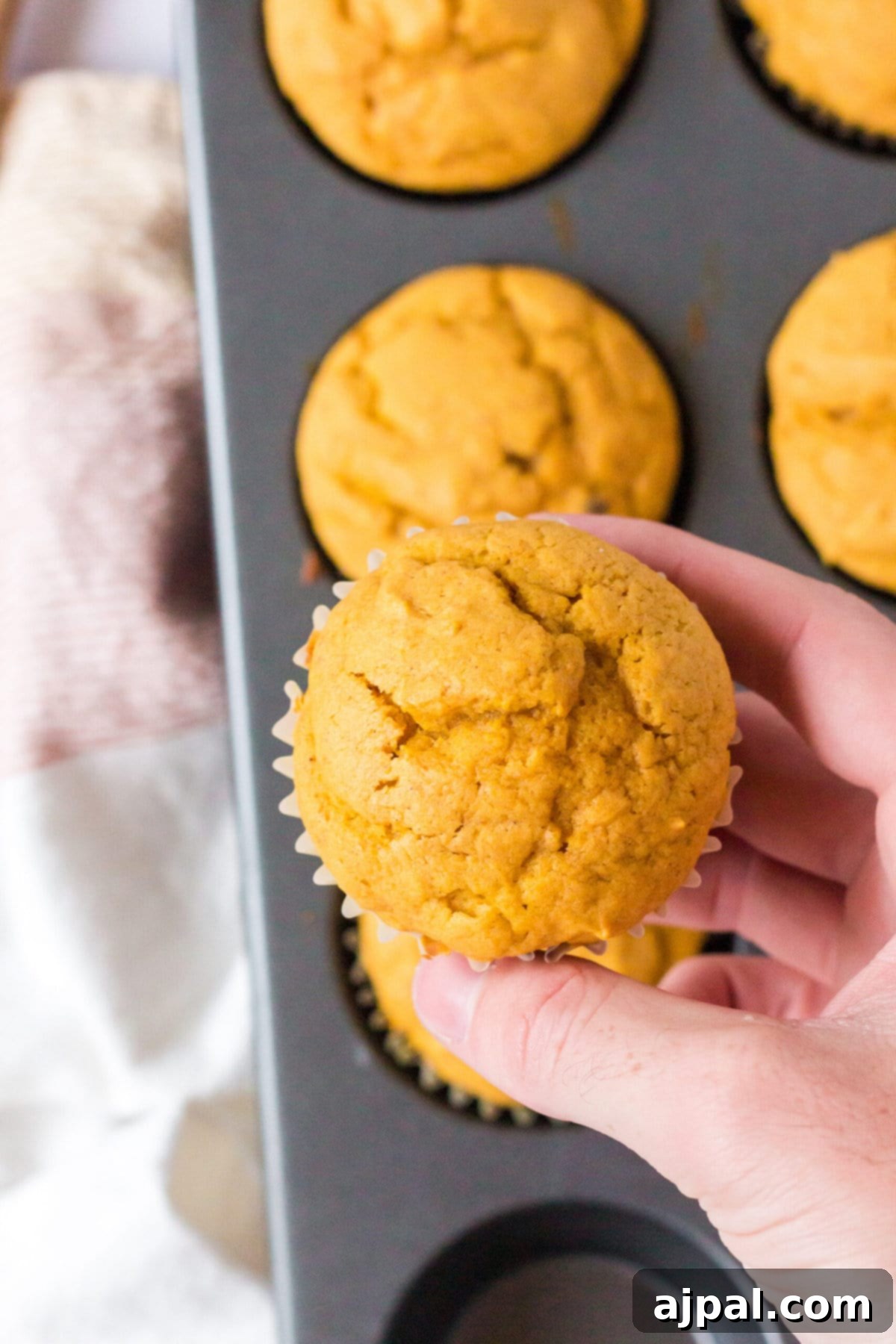 picture of pumpkin spice muffins stacked on a table
