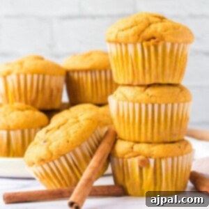 picture of pumpkin spice muffins stacked on a table