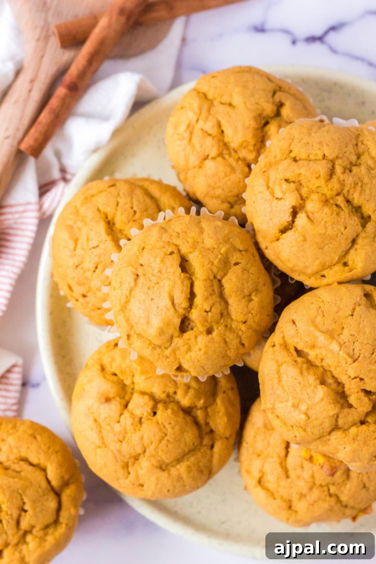 picture of pumpkin spice muffins stacked on a table