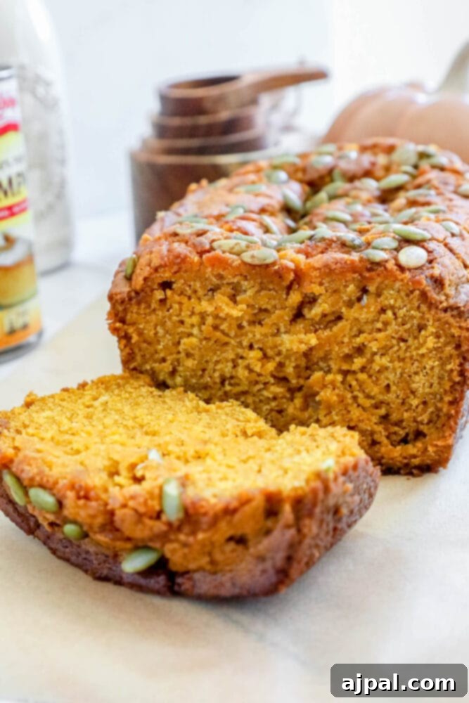 Starbucks-Inspired Pumpkin Bread 4 A slice of Copycat Starbucks Pumpkin Bread on a baking sheet.