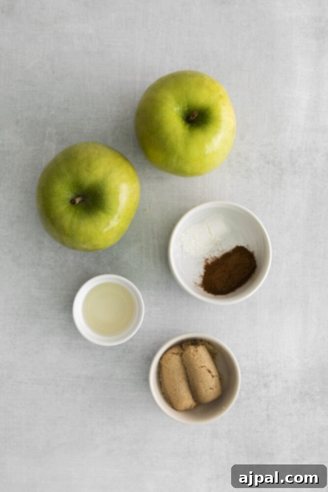 A mix of apples and cinnamon in a bowl, prepared for the galette filling.