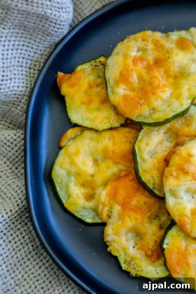 Parmesan Crusted Zucchini 2 Baked Parmesan zucchini chips on a blue plate.