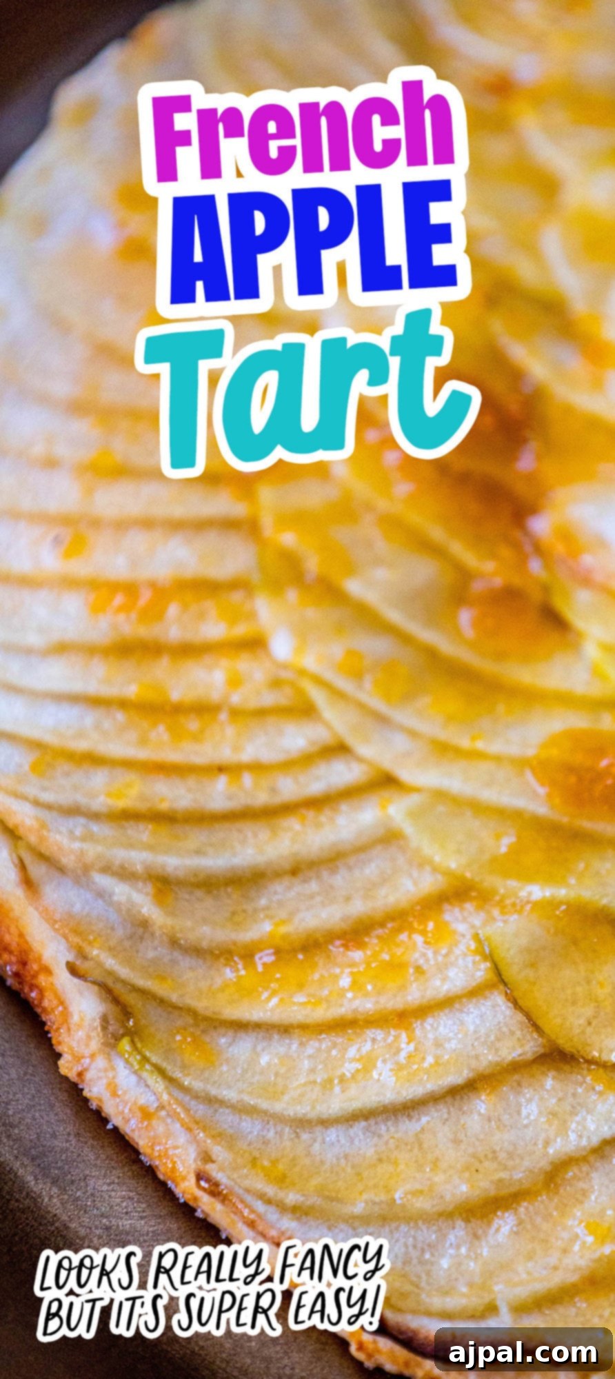 Simple Perfection: French Apple Tart 11 A stunning vertical shot of a French apple tart, perfectly baked with a glossy apricot glaze, positioned on a golden plate.