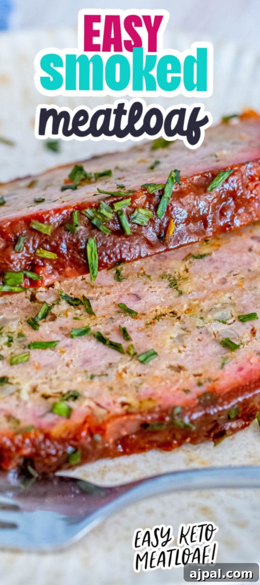 Smoked meatloaf on a plate with chopped chives, beautifully garnished and ready to serve.