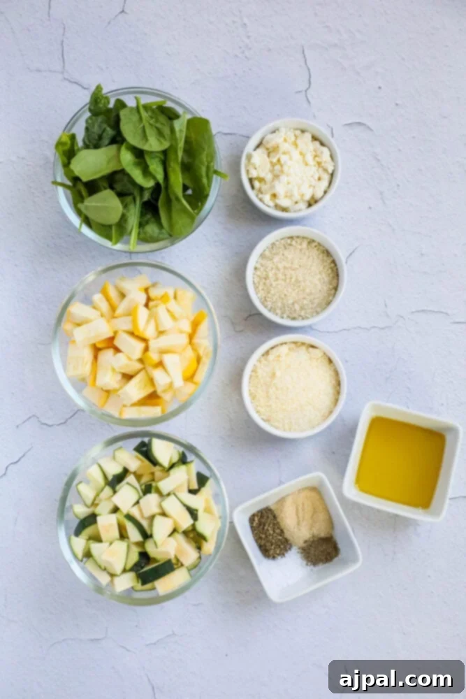 Green & Gold Feta Casserole 5 Individual bowls of fresh spinach, assorted cheeses, zucchini, yellow squash, olive oil, and various herbs and spices, laid out on a table for the casserole preparation.