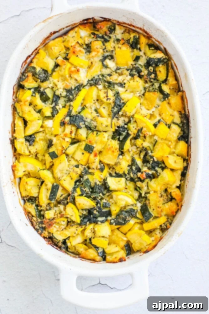 Green & Gold Feta Casserole 9 A perfectly baked squash casserole, golden brown and bubbling with cheese, fresh out of the oven in a white dish.