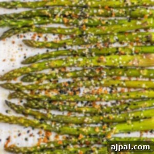 picture of asparagus spears seasoned with everything bagel seasoning