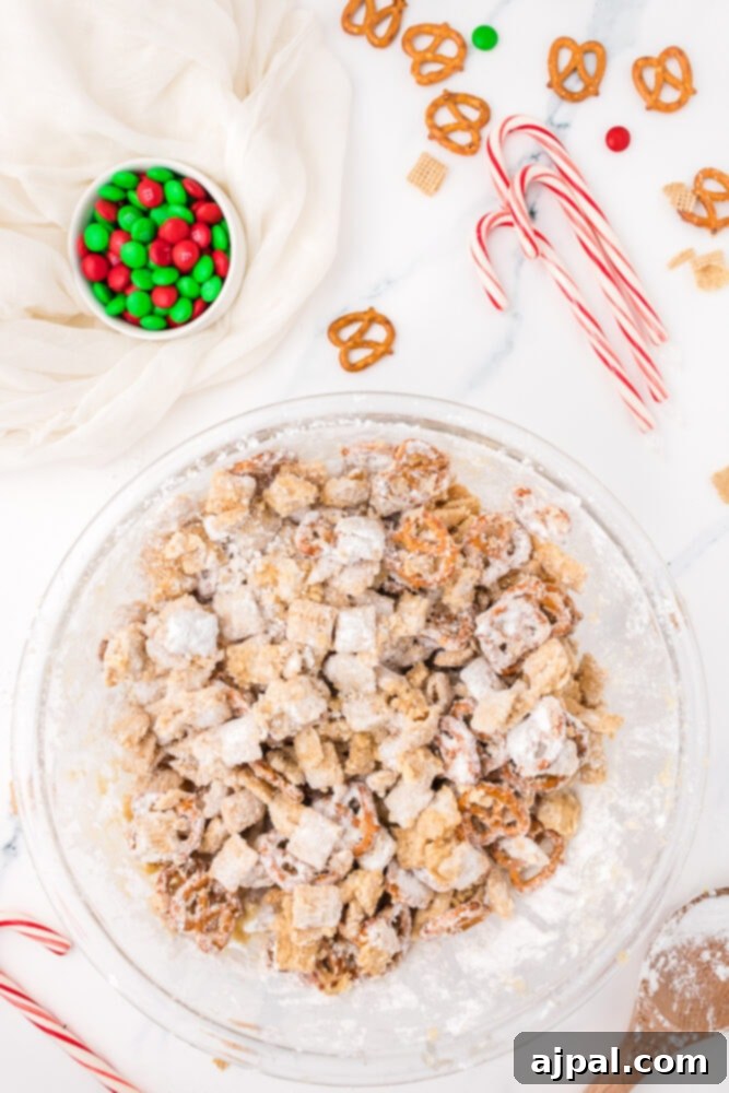 picture of chex and pretzels coated in powdered sugar and peanut butter mixture