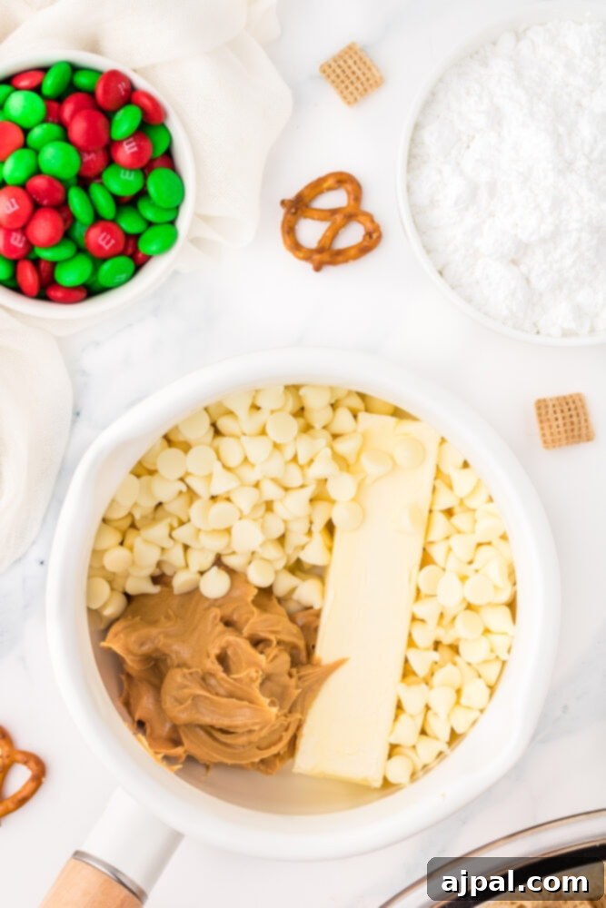 picture of white chocolate chips, peanut butter, and butter in a bowl on a table
