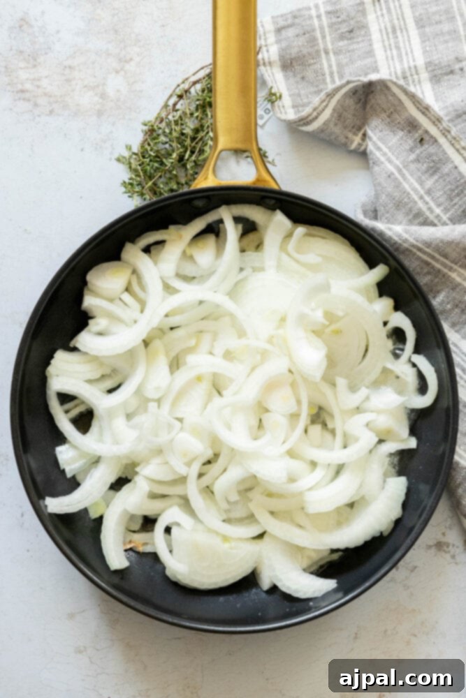 Classic French Onion Chicken Breasts 6 picture of onions sliced in a pan