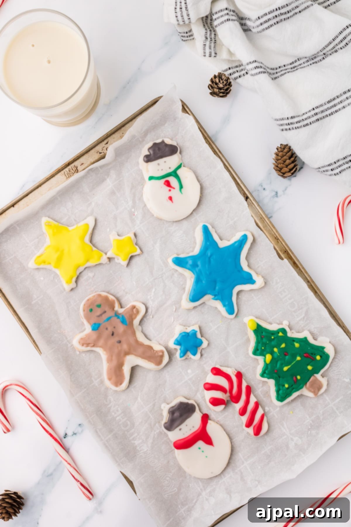Simple Frosted Christmas Sugar Cookies 14 picture of iced christmas cookies on a white plate on a table