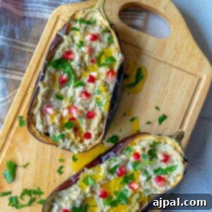 Vibrant Roasted Eggplant with Creamy Tahini and Pomegranate 11 picture of roasted eggplant with tahini and pomegranates and cilantro