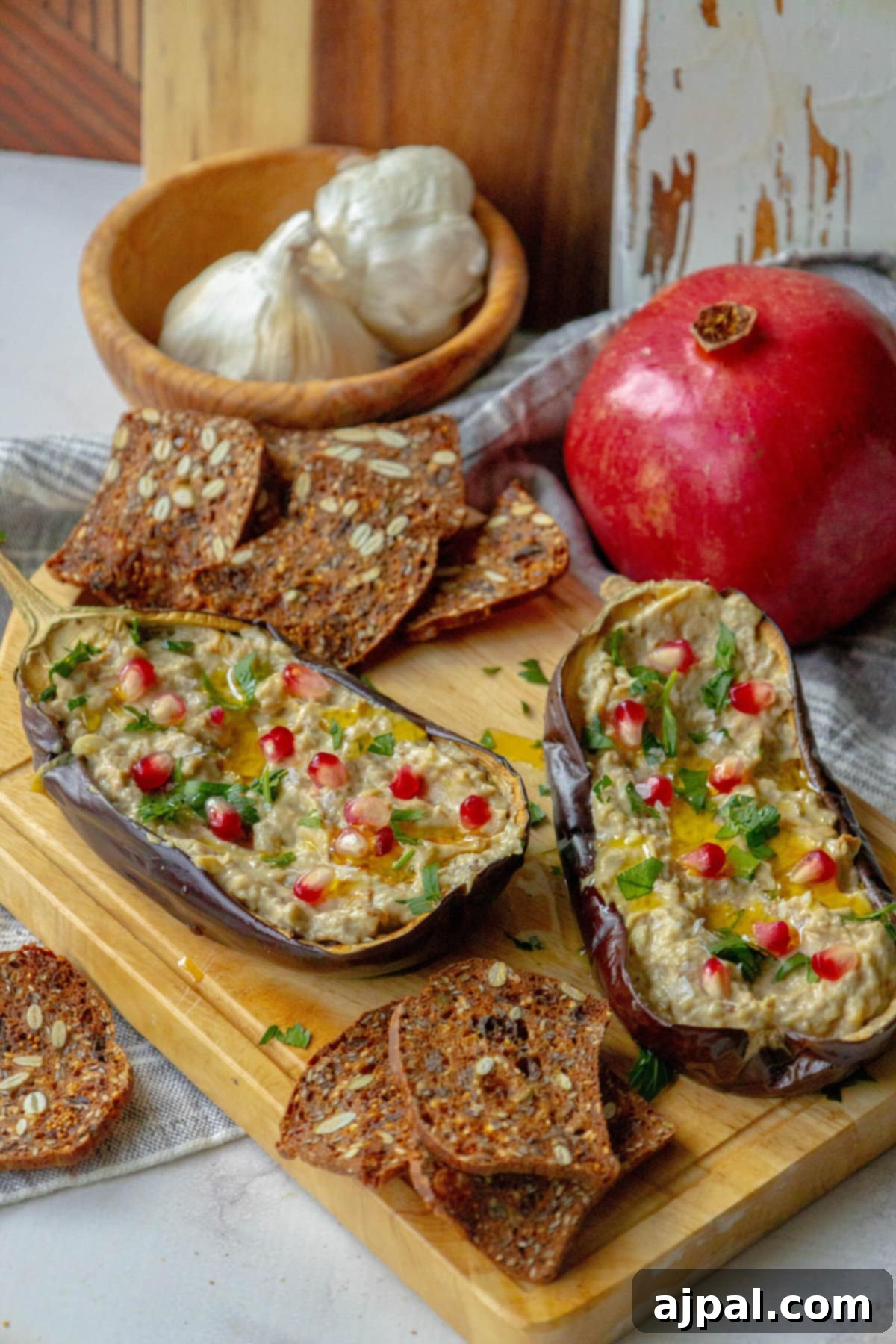 Vibrant Roasted Eggplant with Creamy Tahini and Pomegranate 8 picture of roasted eggplant with tahini and pomegranates and cilantro