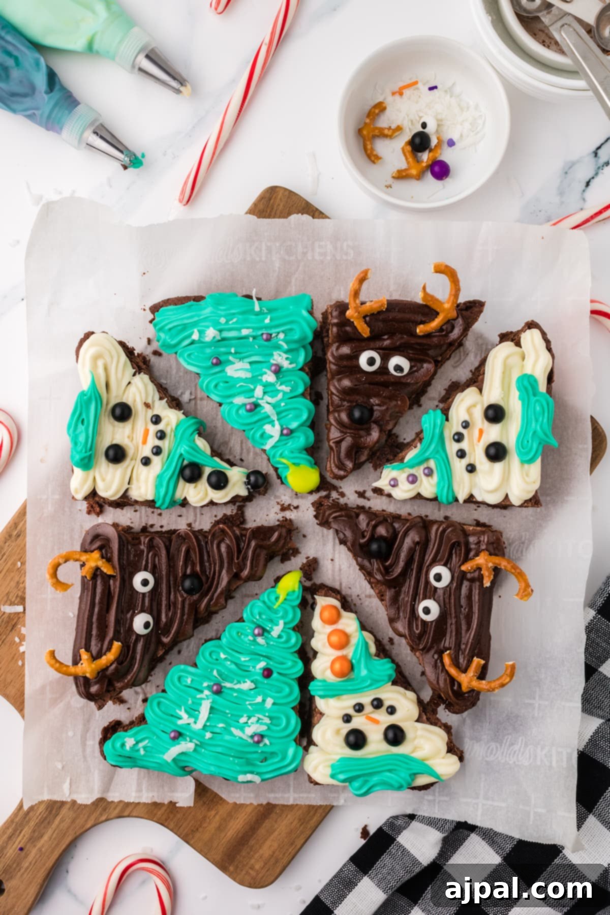 A delightful platter of Christmas brownies, beautifully frosted with chocolate and adorned with festive candy canes.