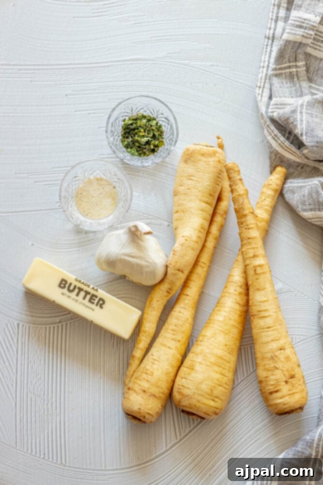 picture of parsnips, garlic, herbs, butter, salt on a table