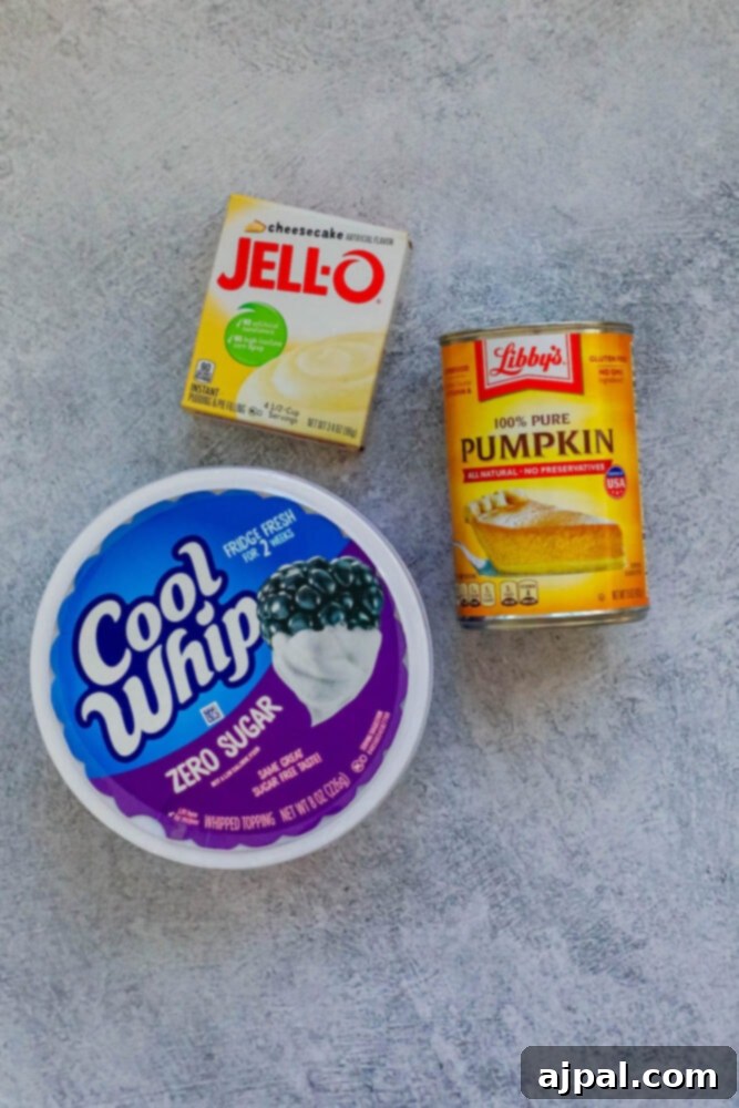 Creamy Pumpkin Dream 5 cool whip, pumpkin pie, and jello mix on a table