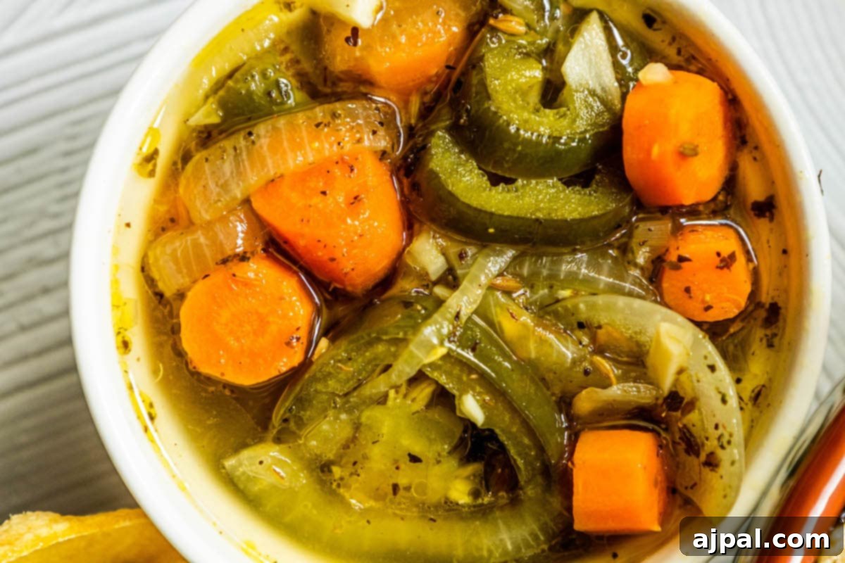 Zesty Carrot Jalapeno Relish 4 pickled sliced carrots, jalapenos, onions, and spices in a bowl