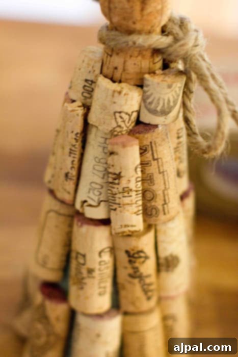 A beautifully crafted DIY wine cork Christmas tree with jute ribbon for display.