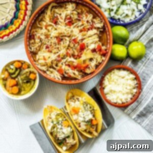 A delicious serving of shredded chicken tacos, ready to be customized and enjoyed.