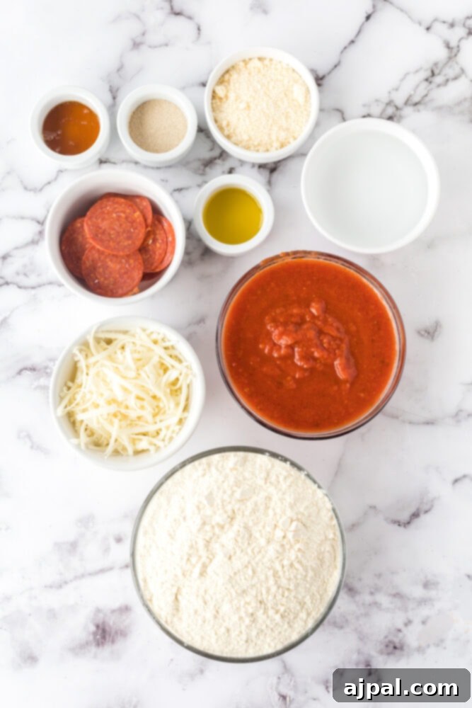 A collection of deep dish pizza ingredients: pizza sauce, shredded cheese, flour, pepperoni, oil, salt, and yeast, neatly arranged in bowls on a table.