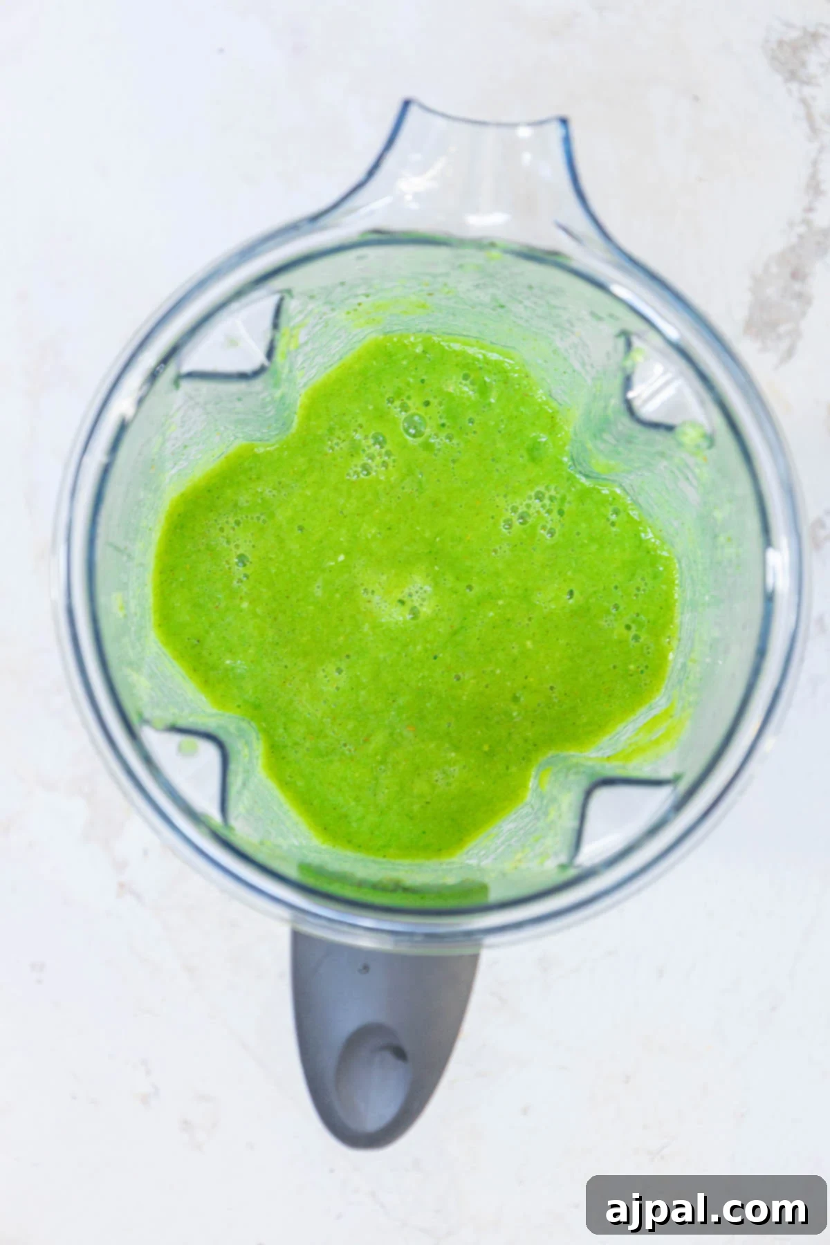 blended peppers, tomatillos, onions in a blender