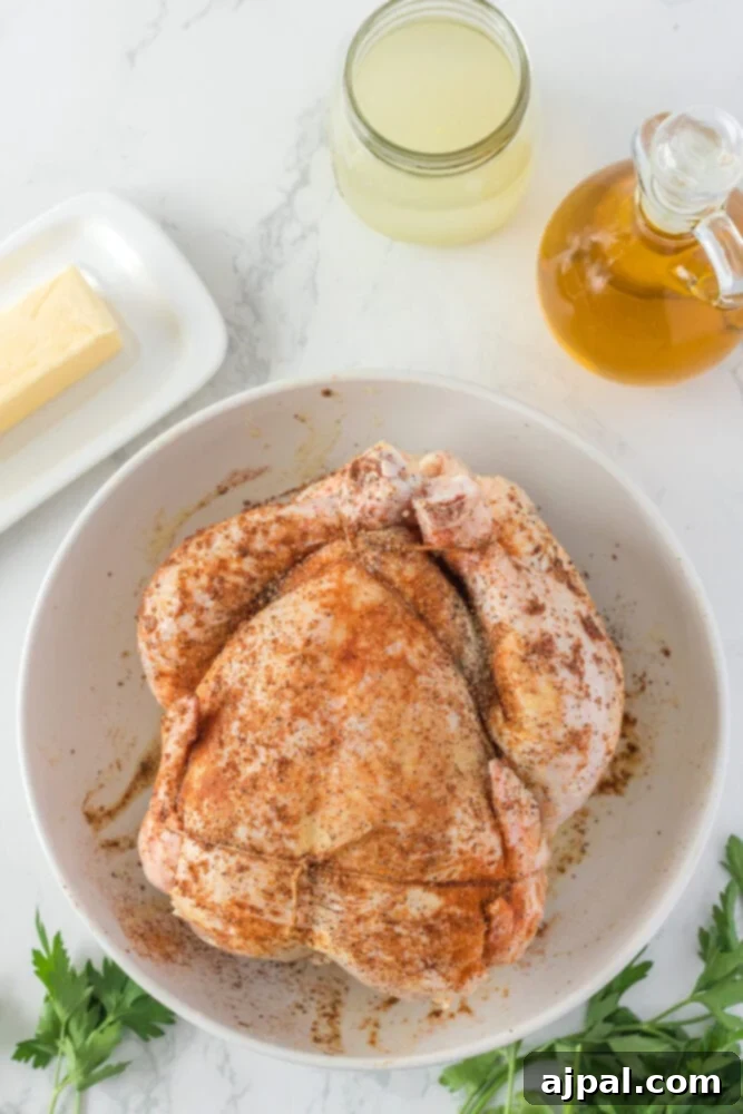 Perfect Instant Pot Whole Chicken 5 seasoned raw chicken in a bowl