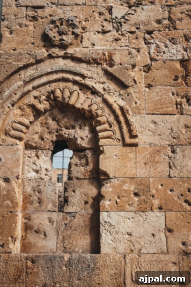 Authentic Jerusalem Salad 8 An ancient stone wall in Jerusalem, featuring a timeless window opening, speaks to centuries of history.