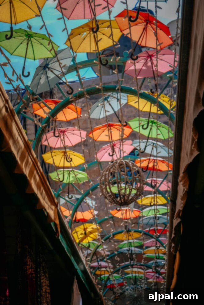Authentic Jerusalem Salad 10 A vibrant scene from Machane Yehuda Market, with colorful umbrellas suspended over bustling food stalls.