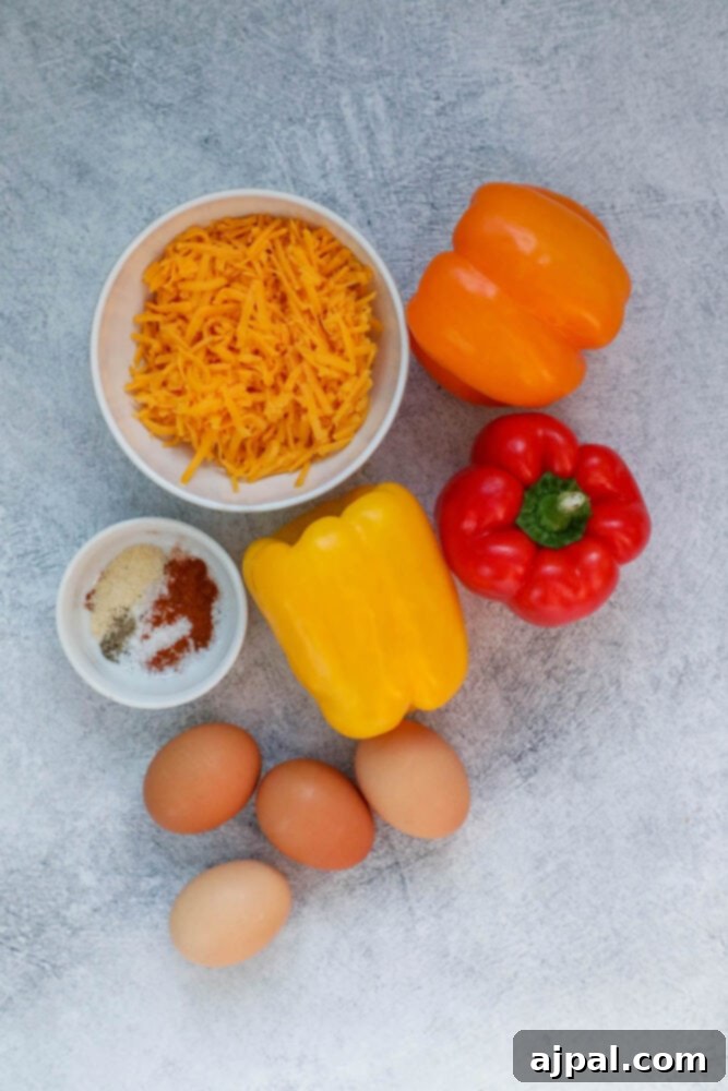 Bell Pepper Egg Bake 4 cheese, peppers, eggs, herbs in bowls on a table
