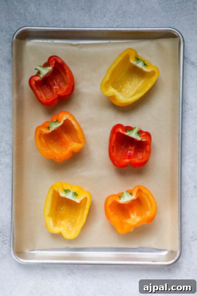 Bell Pepper Egg Bake 5 bell peppers cut in half on a baking sheet lined with parchment paper