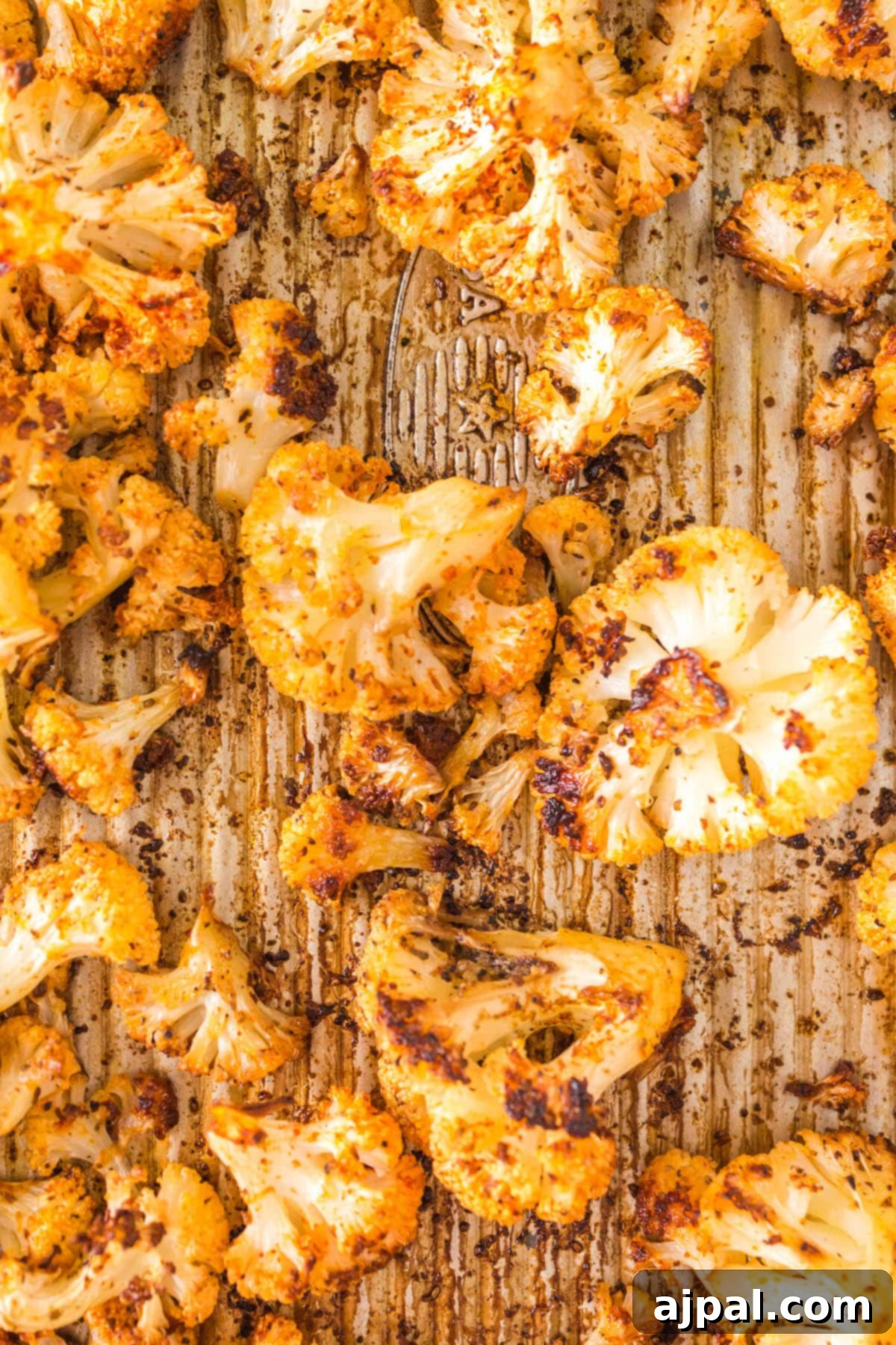 browned air fried cauliflower on a tray 