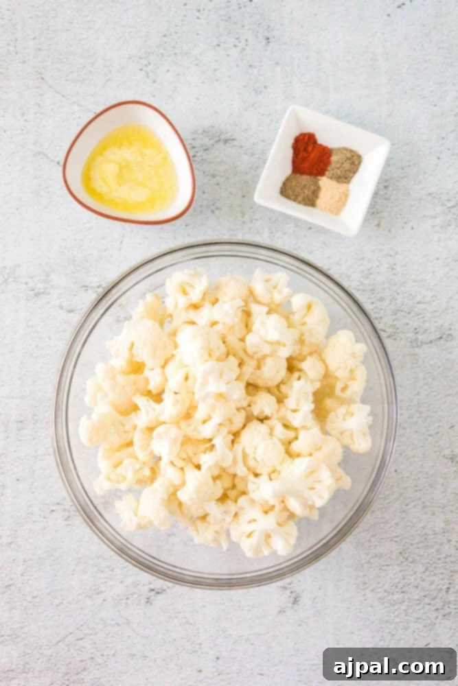 cauliflower, melted butter, spices on a table