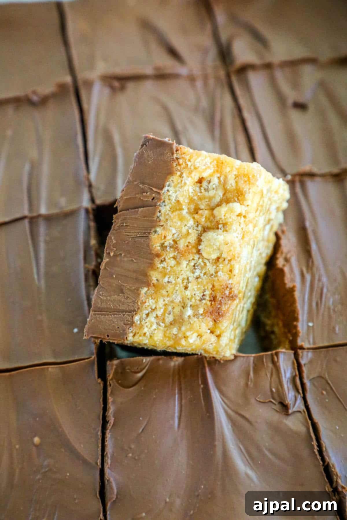A piece of chocolate graham cracker scotcheroos bars.